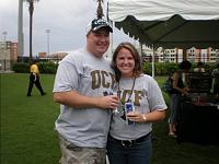 Doug and Amanda getting ready to cheer for UCF with fuel in hand.