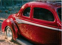 1940 candy apple red ford coupe. won The Best Dressed List 1996, the top 5 paint jobs chosen out of nation wide copetition.