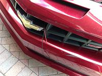 Bring the wires for the illuminated bow tie through the radiator area and grill and leave enough leads to trim them back once you remove the factory bow tie and install the lighted bow tie.