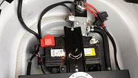 The supercharger cooling accessories in the trunk.