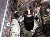 Close up of dirty engine bay and Elite catch can