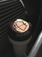 image 
 
Copper capped windshield washer cap with pollished aluminum washer logo.