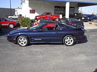 My first new car. 
2000 Trans Am 
6 Speed 
Navy Blue Metallic