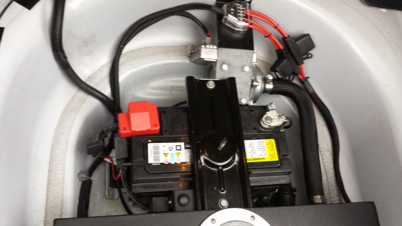 The supercharger cooling accessories in the trunk.